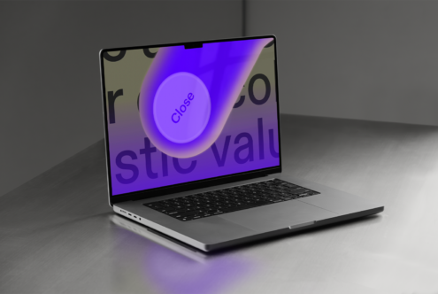 Laptop on metal surface featuring a vibrant purple graphic with text Close on screen ideal for mockups digital design projects SEO keywords: mockups graphic laptop