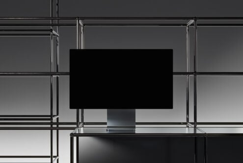 Minimalist mockup featuring a sleek monitor on a metal frame background perfect for showcasing digital designs suitable for graphic designers and creatives.