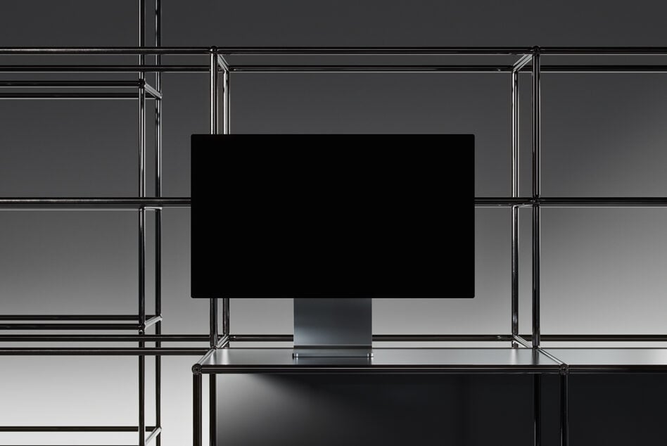 Industrial metal frame display with blank black screen monitor mockup centered