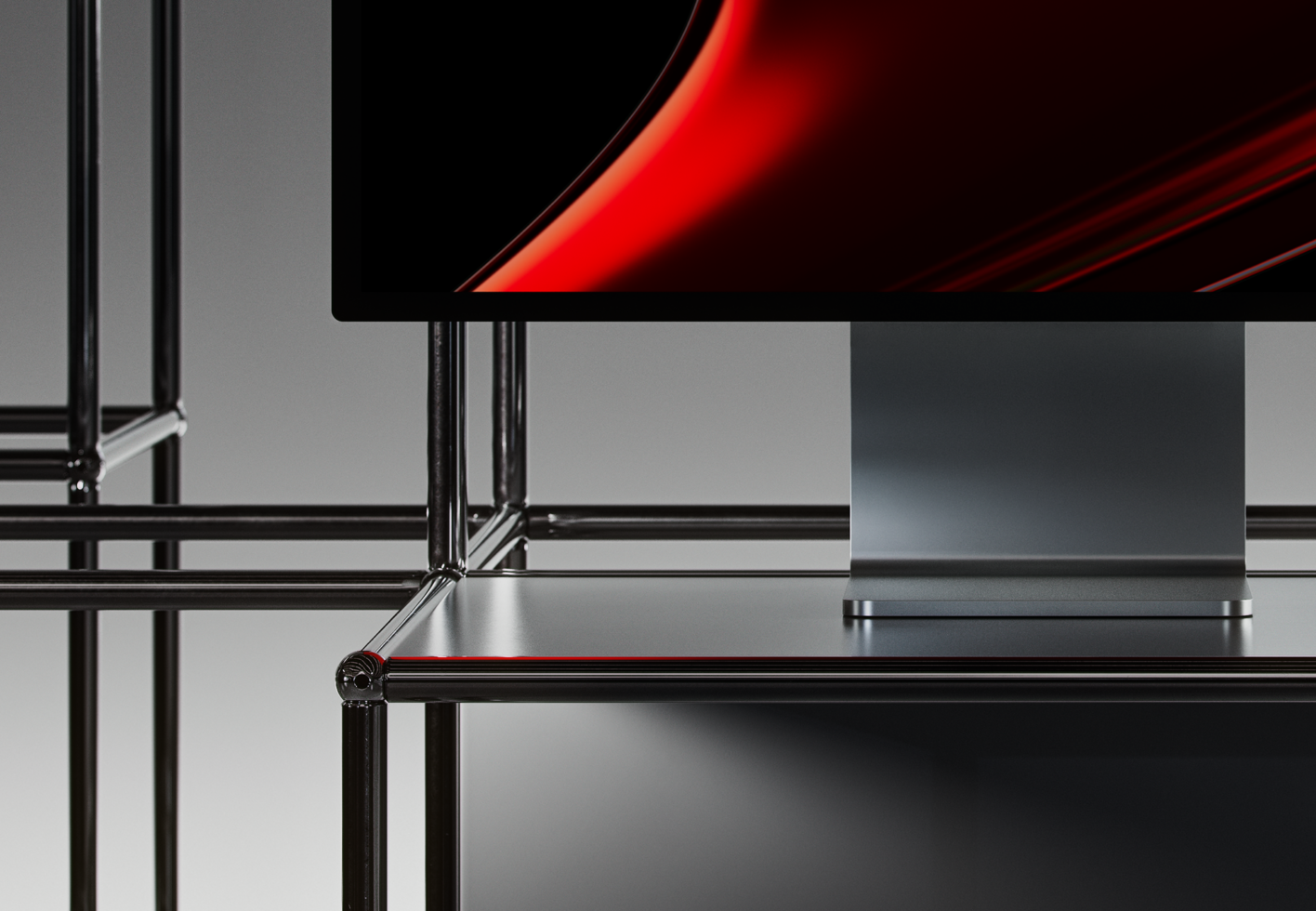 Minimalist desk setup with sleek metal structures and a red-accented monitor. Perfect for a modern office or tech-themed design mockup.
