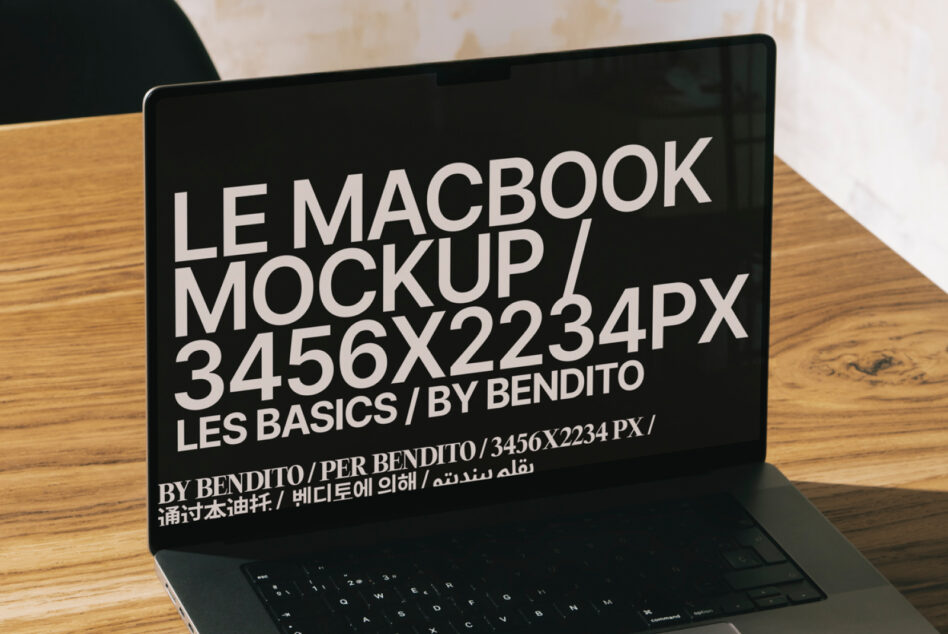 MacBook mockup with dark screen on wooden desk, white typography overlay