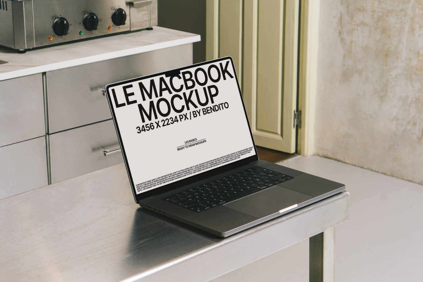 MacBook Pro mockup on white desk with bright screen showing typography layout mockup