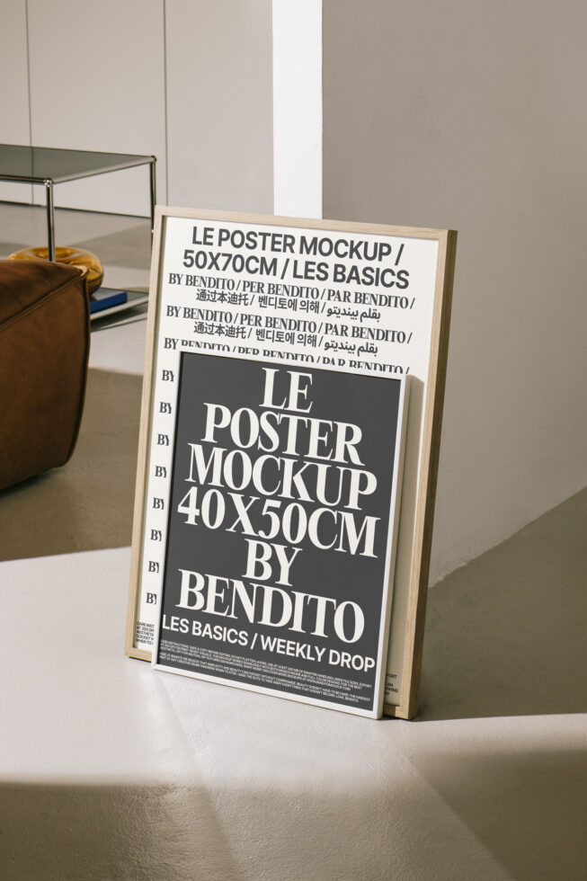 Single framed poster leaning on minimalist shelf with brown vase nearby