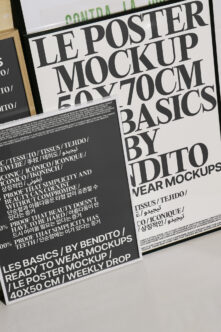 Close up of tilted poster mockup with bold serif type on white paper in wood frame