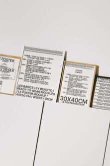 Multiple poster mockups in wood clips on white background, various sizes