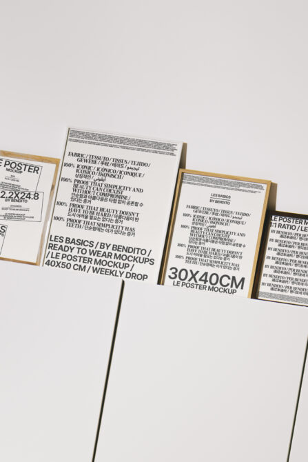 Multiple poster mockups in wood clips on white background, various sizes
