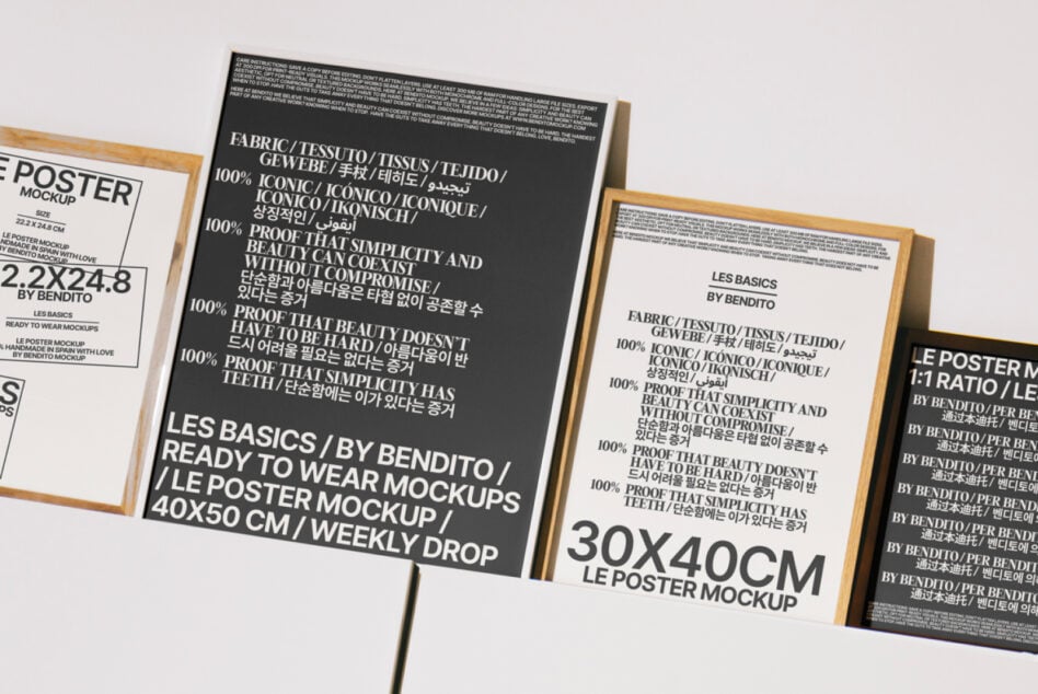 Stacked framed posters with black, white, multilingual typography in wooden frames