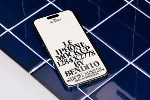 iPhone mockup on blue tile background showcasing 1284 x 2778 resolution perfect for designers in need of high-quality, ready-to-use responsive mockups.