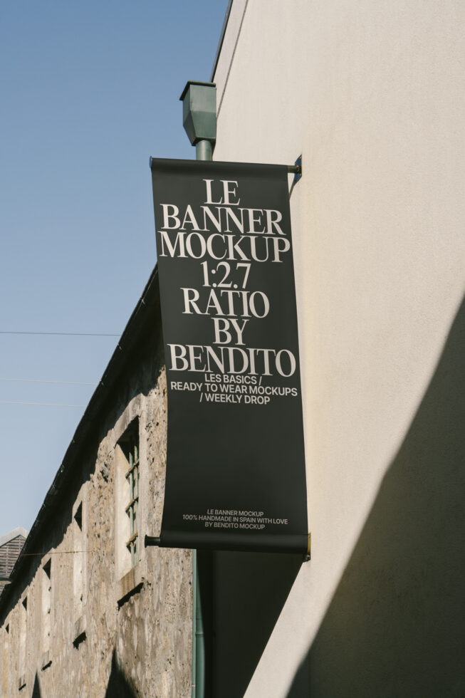 Outdoor banner mockup with 1:2.7 ratio hanging on wall ideal for designers. Vertical format with shadow. Perfect for branding presentations.