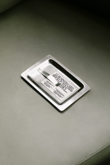 Business card mockup on silver tray background. Minimalistic design template. Ideal for branding presentation. Mockups category for designers.