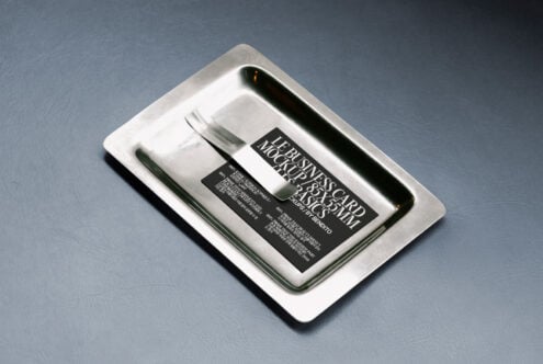 Business card mockup on a sleek metal tray with leather background Ideal for showcasing card designs Perfect for designers Graphics Mockups Templates