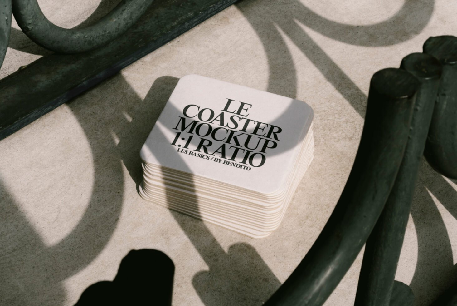 Stack of square coasters with text Le Coaster Mockup 1 to 1 Ratio on a textured surface with curved shadows design resource for designers and mockups.