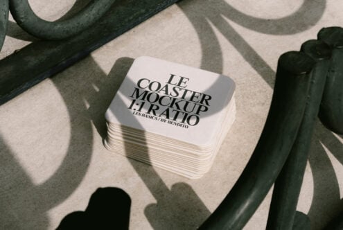 Stack of square coasters with text Le Coaster Mockup 1 to 1 Ratio on a textured surface with curved shadows design resource for designers and mockups.