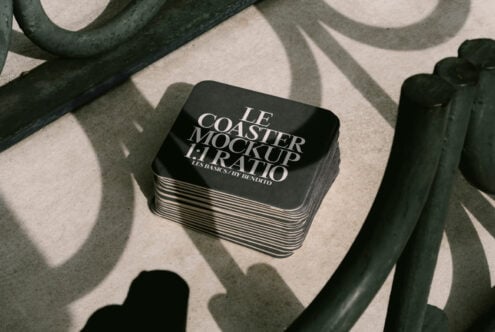 Stack of square coasters with text Le Coaster Mockup 1:1 Ratio on concrete surface showcasing elegant design perfect for branding and presentation mockups.
