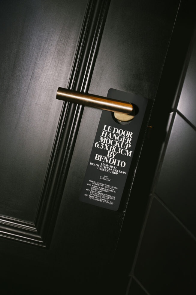 Door hanger mockup on black door with gold handle ideal for designers seeking realistic templates for branding and promotional presentations.