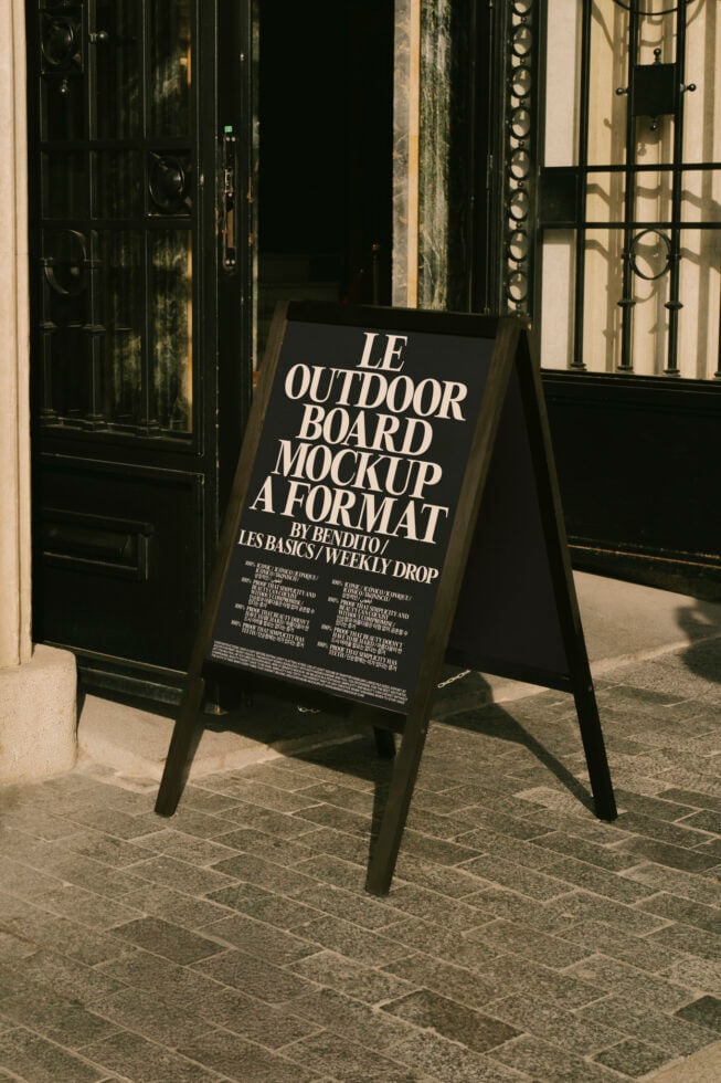 Outdoor board mockup set in front of a vintage building entrance showcasing elegant typography versatile for advertising designs and promotions.
