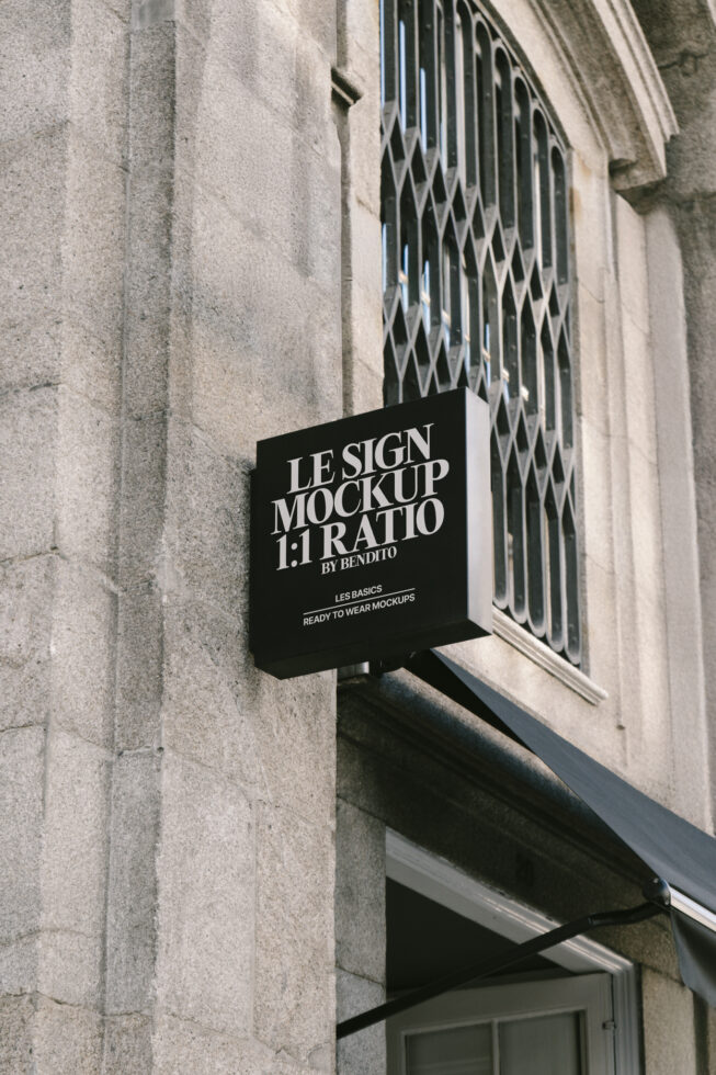 Outdoor square sign mockup on textured stone building wall perfect for branding presentations and showcasing graphic design projects realistic context