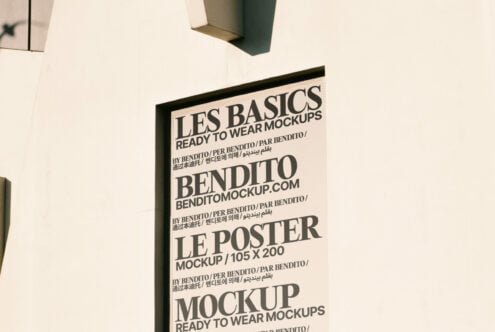 Poster mockup displayed on a building wall featuring bold typography. Suitable for designers seeking high-quality mockups for branding and advertising.