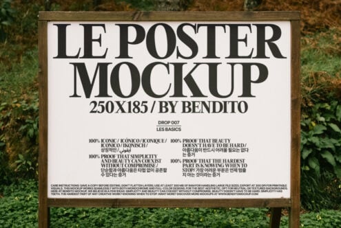 Outdoor poster mockup on wooden stand with lush greenery background ideal for design presentation. Keywords: poster mockup, outdoor, design, template.