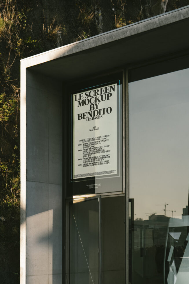 Poster mockup on modern building facade with sunlight and reflections. Ideal for showcasing design portfolios or advertising projects. Graphic design asset.
