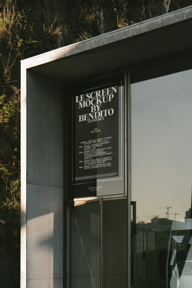 Outdoor poster mockup displayed on a modern concrete building with glass windows reflecting city skyline. Keywords: mockup design, poster template, urban setting.