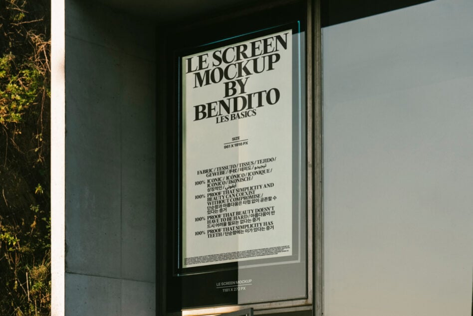 Light cream poster in glass display case on urban storefront exterior