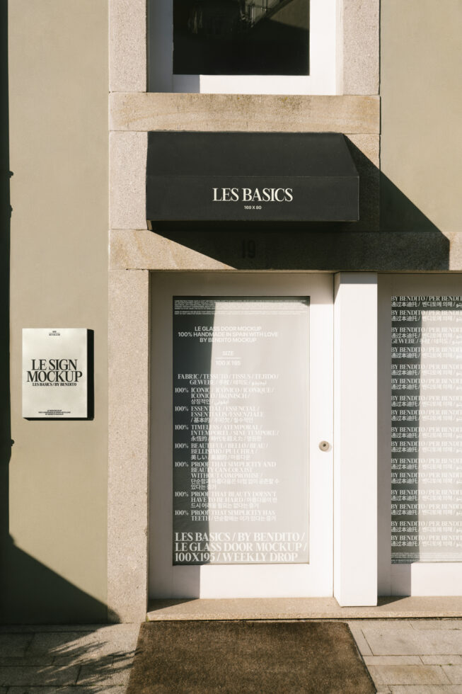 Mockup of a storefront with glass door featuring text overlays. Ideal for showcasing branding or signage design. Keywords: mockup, branding, signage.