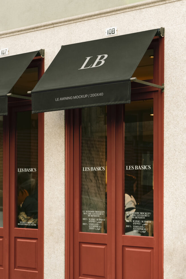 Storefront awning mockup with customizable text Les Basics branding window graphics urban design template exterior signage realistic scene mockup.
