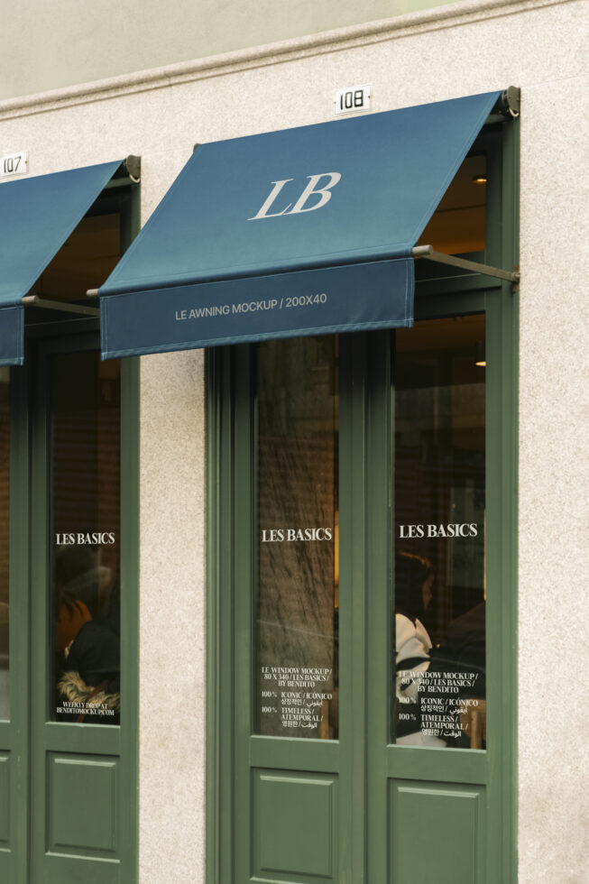 Storefront with blue awning mockup 200x40 on exterior with Les Basics branding for designers seeking window and awning templates graphics mockups.