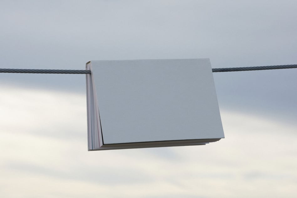 Blank business card mockup hanging on wire outdoor setting
