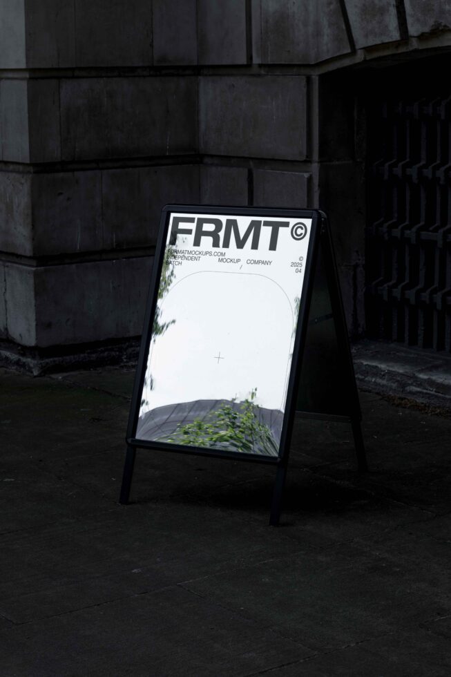 Sidewalk sandwich board sign with white mockup space, FRMT branding at top, concrete setting