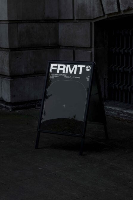 Sidewalk sandwich board sign with dark mockup space, FRMT branding at top, concrete setting