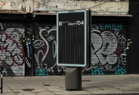 Urban billboard mockup in a gritty city scene with graffiti-covered walls in the background ideal for showcasing advertisement designs to designers.