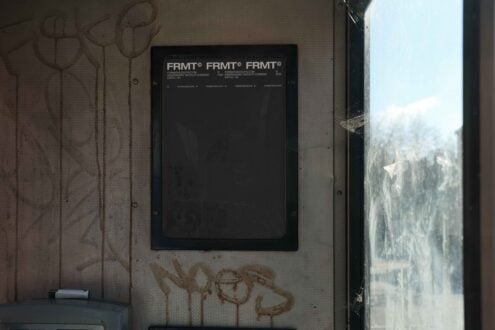Urban mockup display featuring a weathered panel with graffiti and a dirty window. Ideal for showcasing grunge designs or urban-themed graphics.