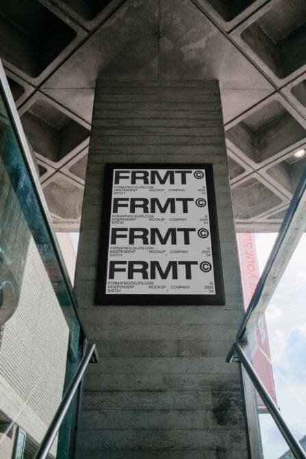 Black poster mockup with four repeated FRMT logos on concrete ceiling shot
