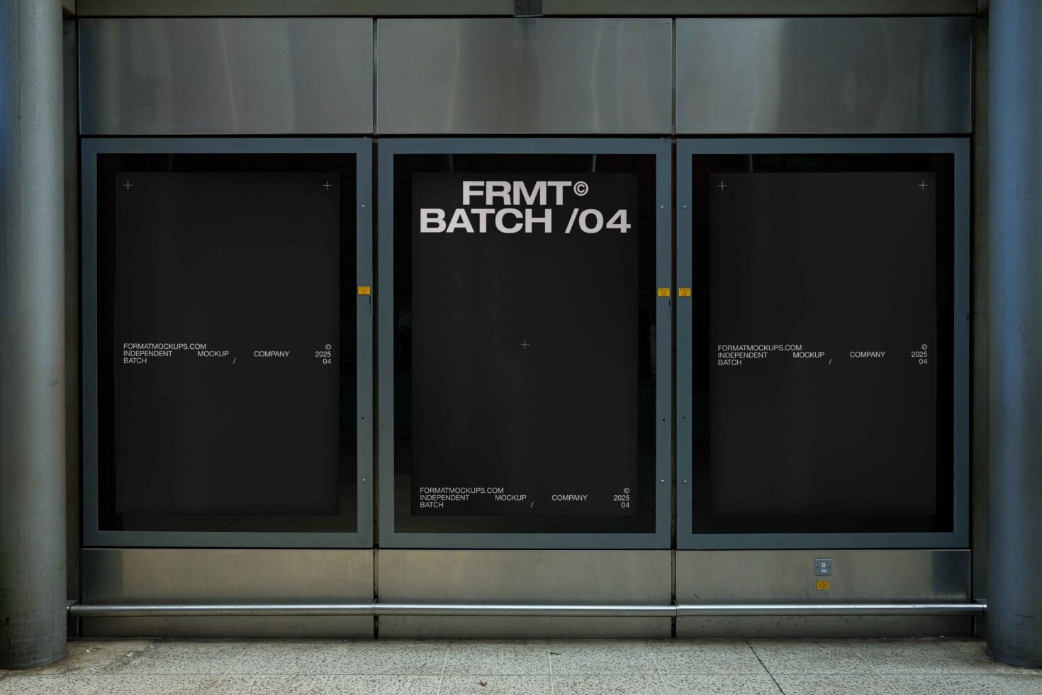 Dark storefront display with three black-framed posters showing FRMT Batch 04 text centered