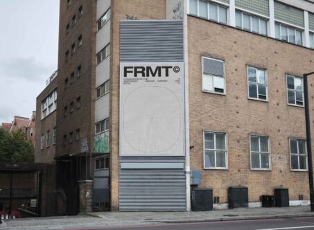 Urban building facade mockup showcasing customizable digital banner design, perfect for graphic designers creating realistic city environment presentations.