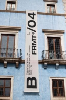 Outdoor banner mockup on blue building wall showcasing bold typography design perfect for graphic designers and template creators seeking realistic presentation.