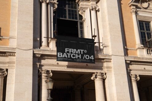 Banner mockup displayed on a classical building facade, ideal for designers. Keywords: mockup, design, architecture, classical, banner, facade, display.