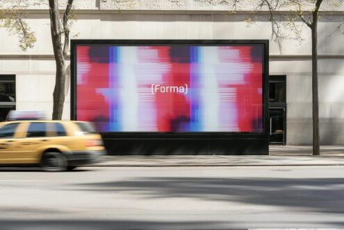 Urban street billboard mockup with abstract digital art in vibrant red and blue hues ideal for graphic design presentations and advertising showcases.