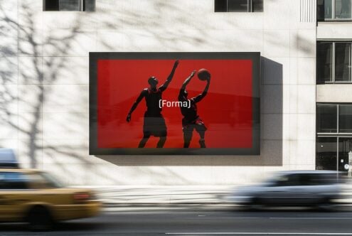 Urban billboard mockup showcasing basketball players silhouette on red backdrop. Perfect for graphic design template digital assets and outdoor advertising.