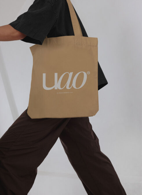 Tote bag mockup featuring beige fabric with stylish text design perfect for branding and identity projects ideal for graphic designers and marketers