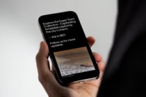 iPhone mockup showing Cape Town travel template with coastal landscape photo on black screen