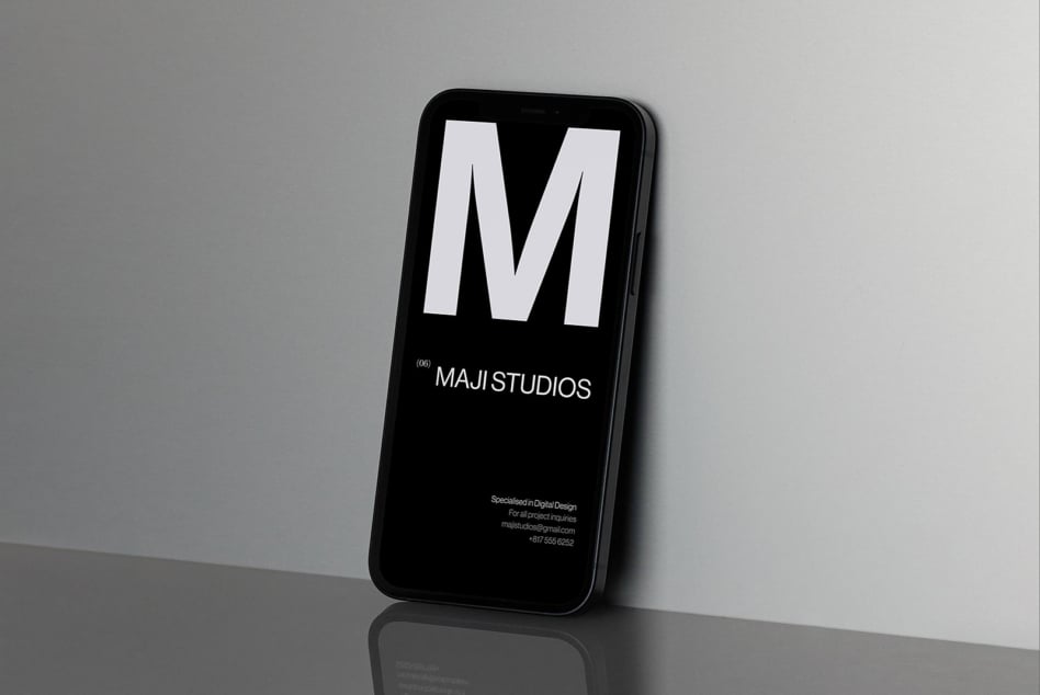 Smartphone mockup featuring MAJI STUDIOS branding on a sleek modern screen ideal for digital design presentations and branding concepts for designers.