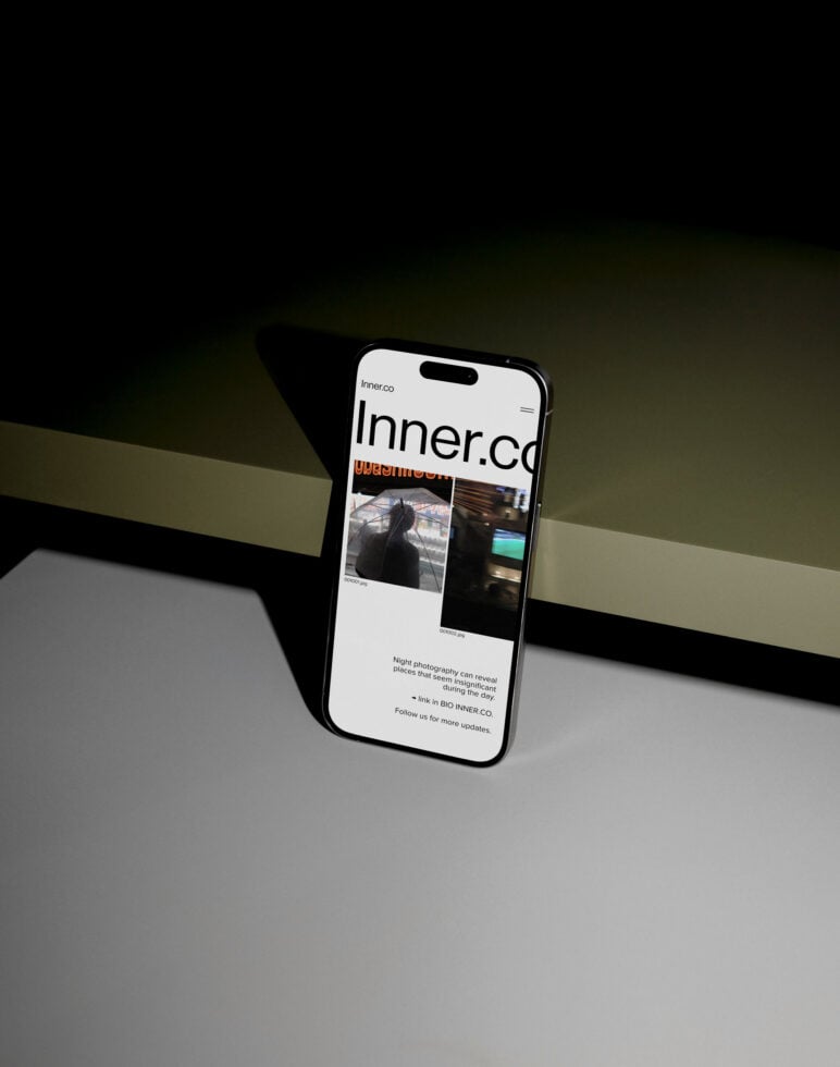 Smartphone mockup showcasing a modern website interface with sleek layout and minimalist design set against a stylish dark background ideal for designers.