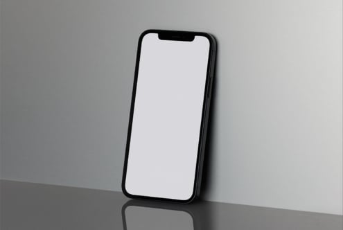 Smartphone mockup with blank screen leaning on a reflective surface perfect for app design presentations digital asset for designers graphic mockups templates