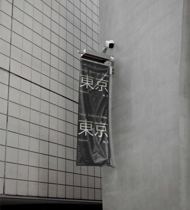 Wall banner mockup displaying Tokyo Collection Vol 2 text hanging on a tiled building exterior, ideal for urban design showcases and marketing graphics.
