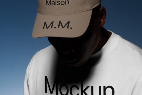 Fashion mockup featuring a model wearing a beige cap and white sweatshirt with bold typography. Ideal for apparel branding and design presentations.