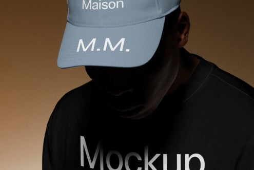 A stylish dark-themed mockup featuring a person wearing a branded cap and shirt. Perfect for designers creating apparel graphics and fashion templates.