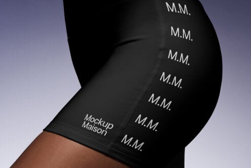 Close-up of black leggings displaying repeating letters MM and Mockup Maison text Mockups Apparel Design Fashion Branding Digital Assets Designers